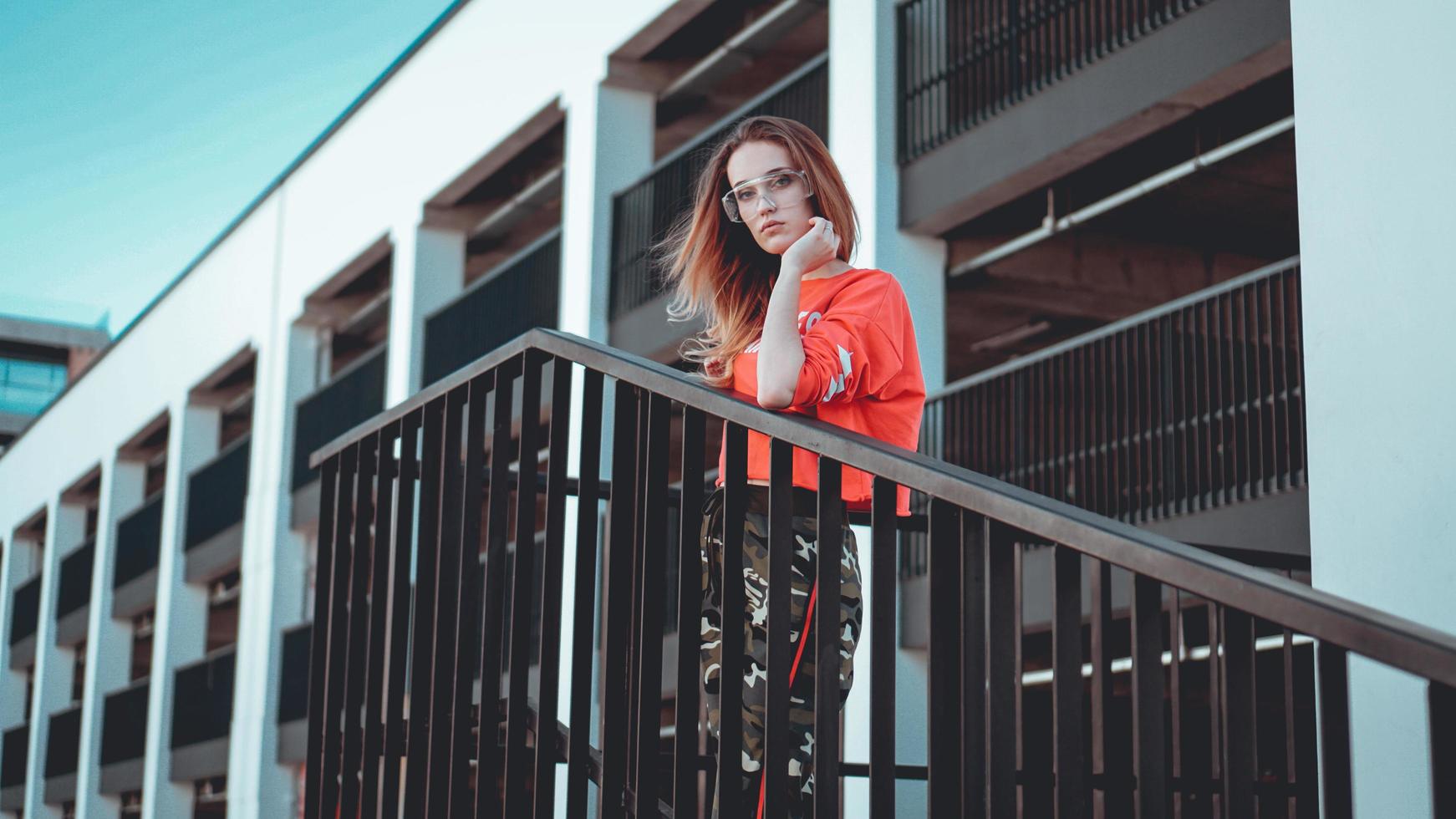 Fashion model wearing red hoodie with inscription los angeles photo