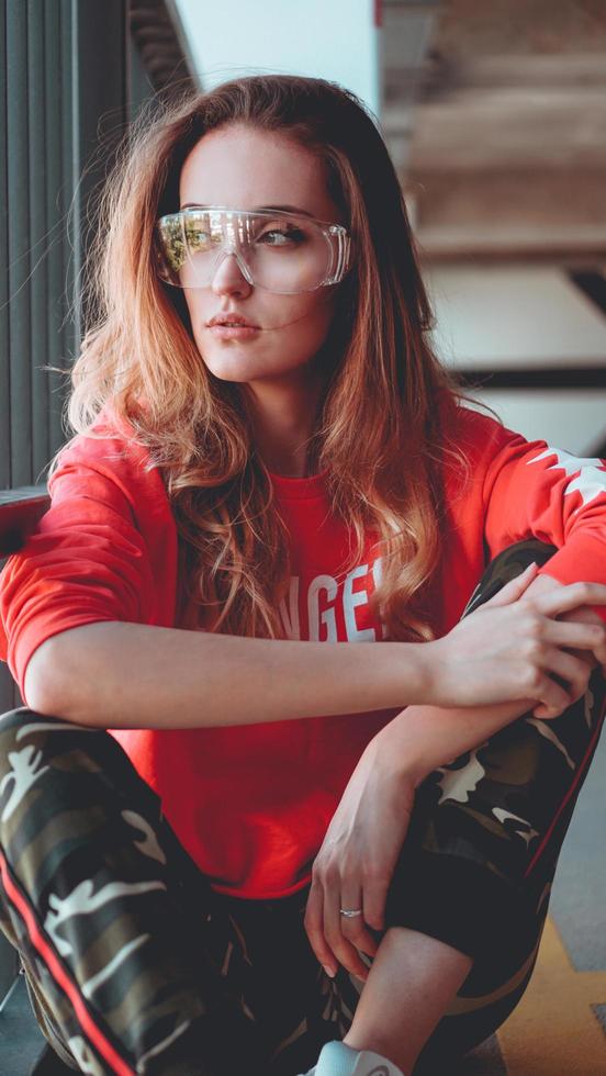 Fashion model wearing red hoodie with inscription los angeles photo