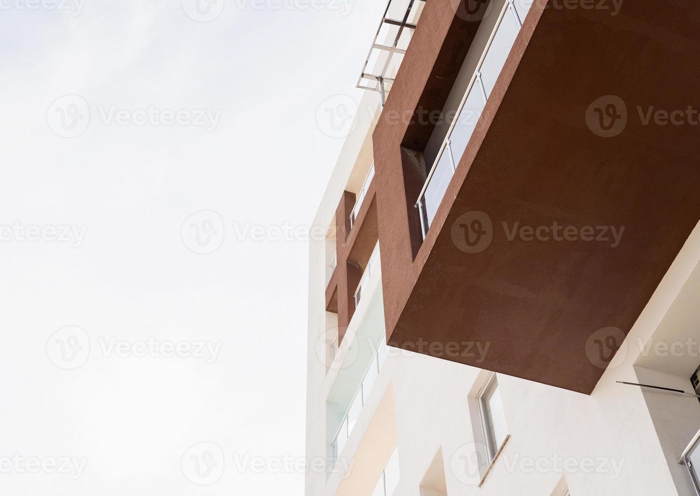 Hotel or apartment building on sky background photo