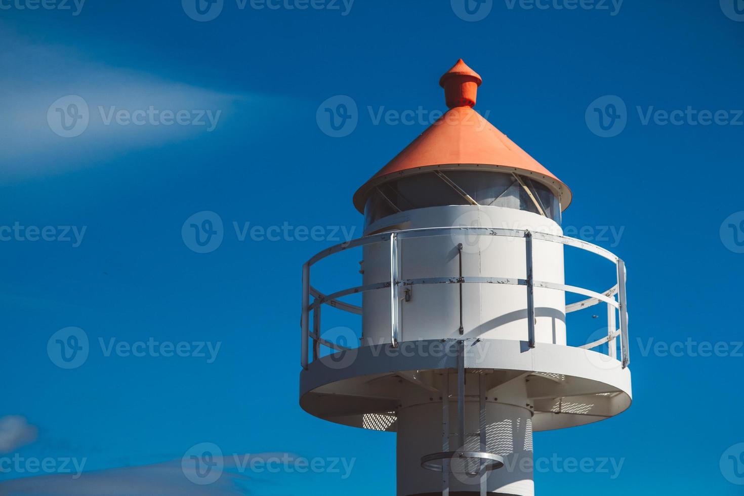 Lighthouse on background of blue sky on Lofoten Islands photo