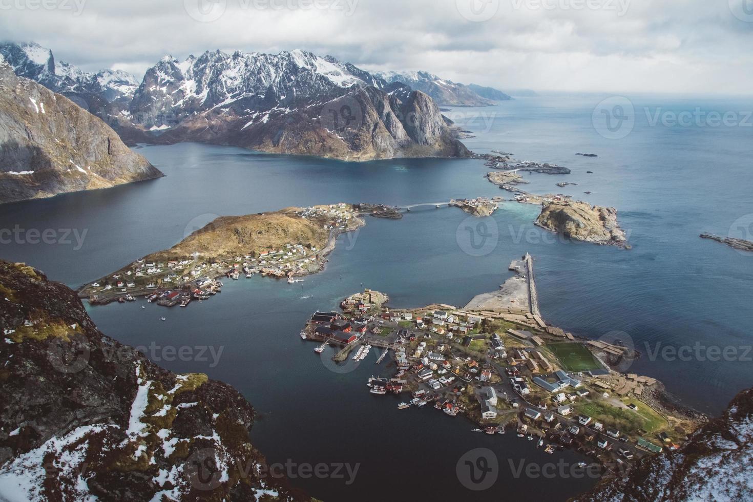 Scenic landscape of Lofoten islands peaks, lakes, and houses photo