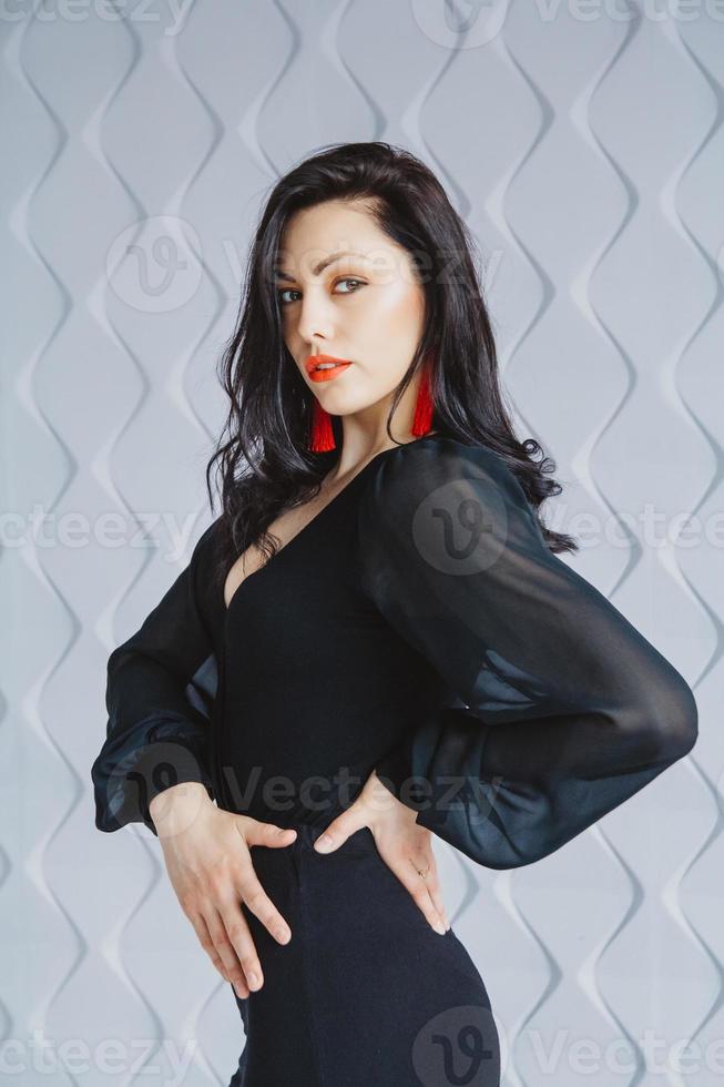 Portrait of a stylish woman on a gray background photo