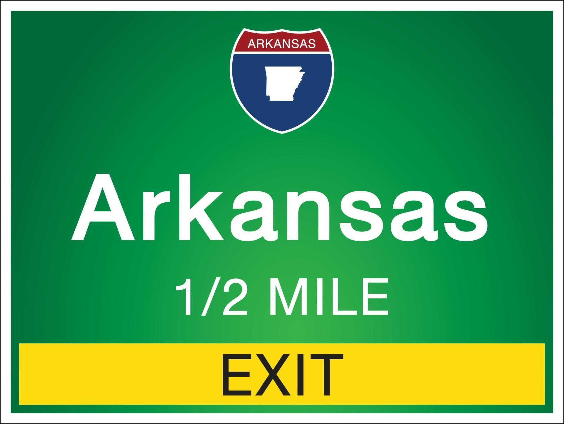 Highway signs before the exit To Arkansas state information and maps