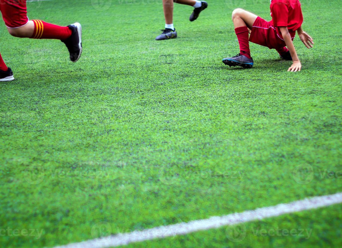 The footballers are competing in color sports of elementary school photo