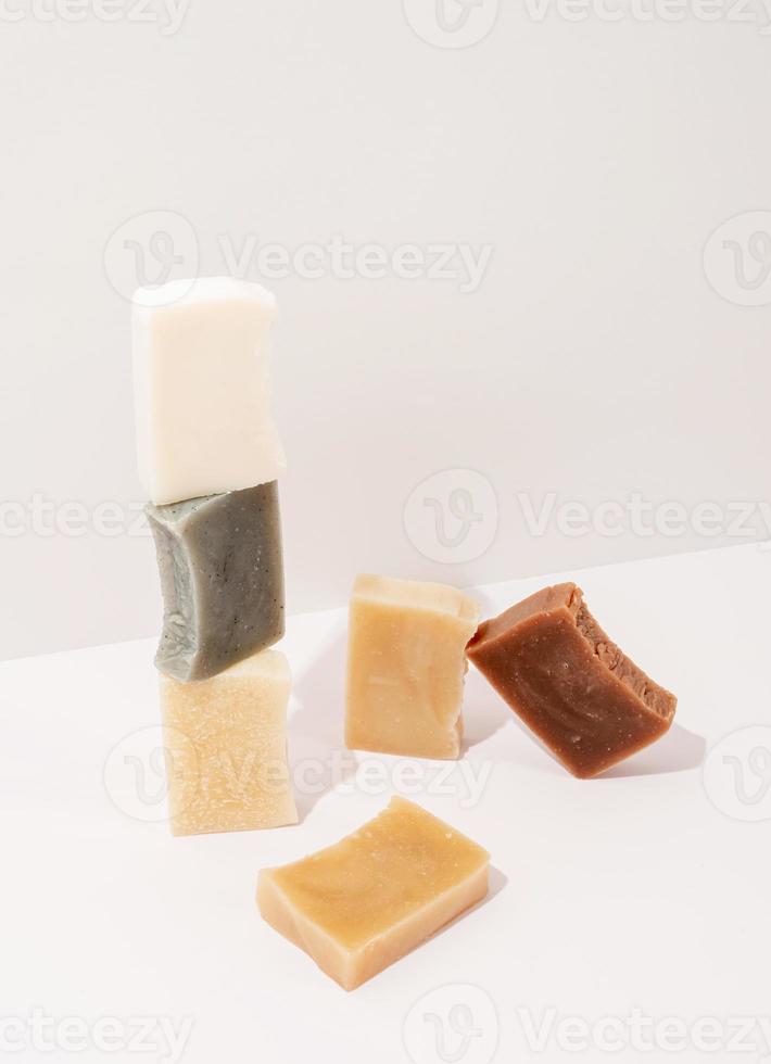 Stack of hand made soap on white background photo