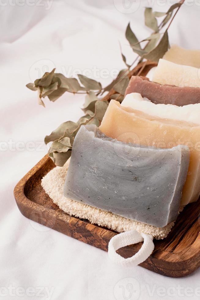 Stack of hand made soap on white background photo