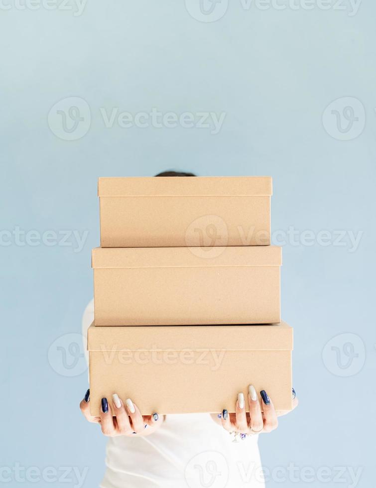 Woman holding blank boxes photo