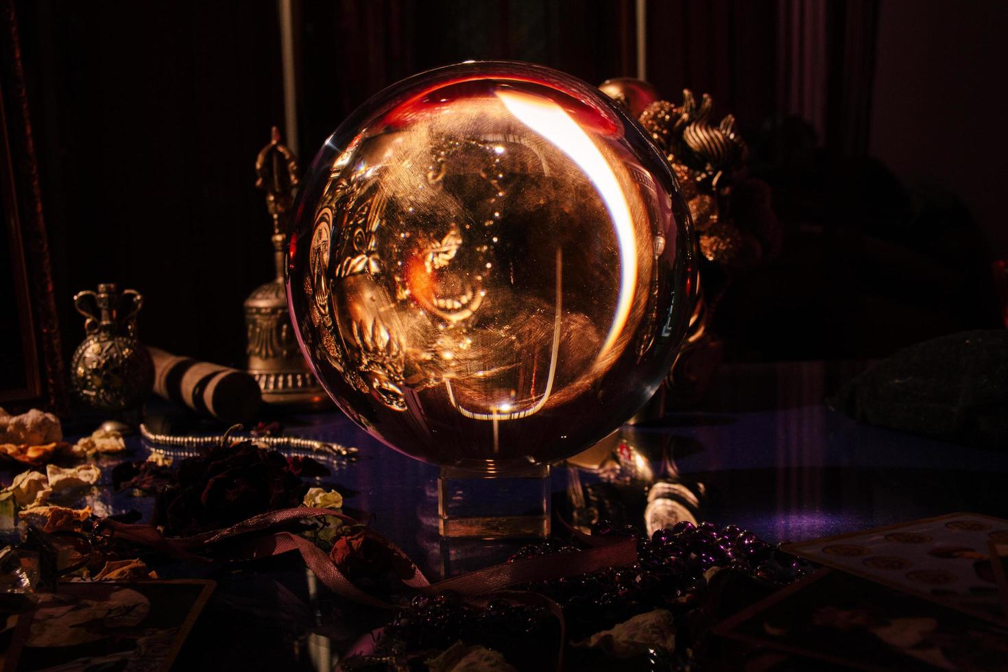 Beautiful crystal orb in a fortune teller's room. Glass ball. photo
