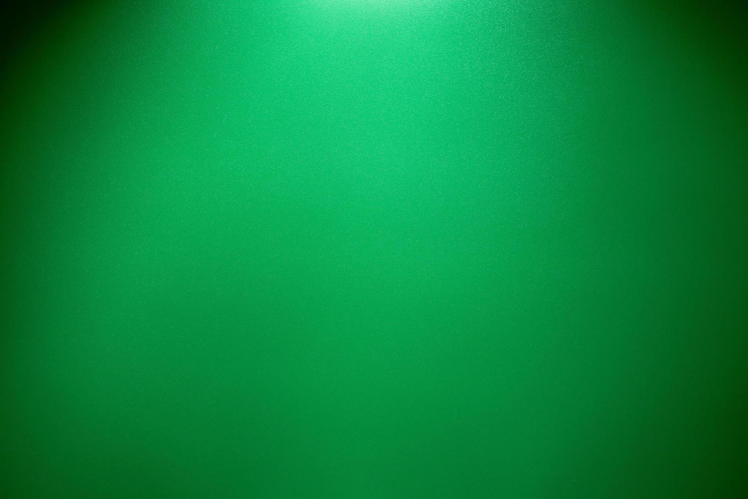 Abstract green background and black vignette border frame photo