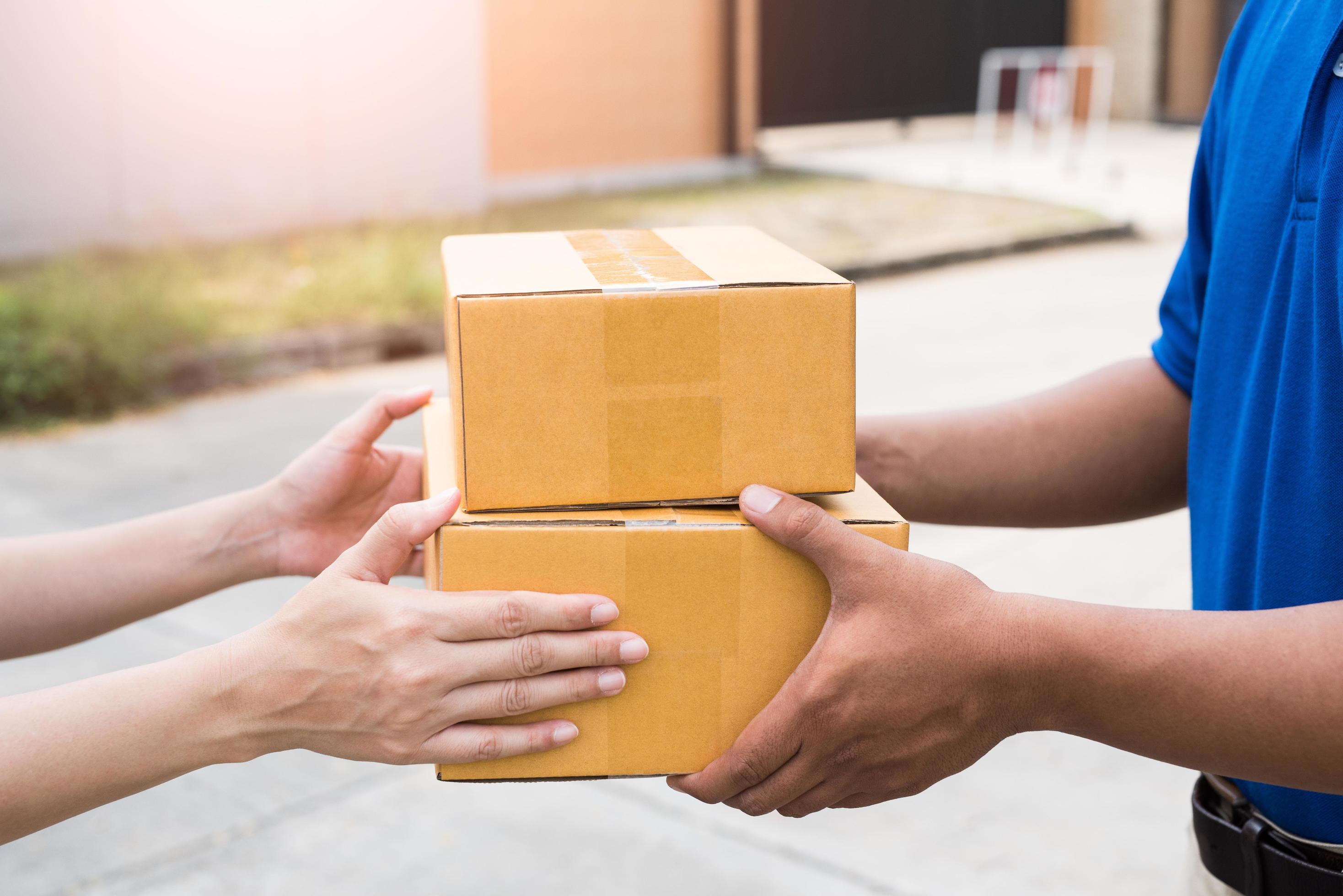 Women hands receiving package from delivery man. 3298189 Stock Photo at