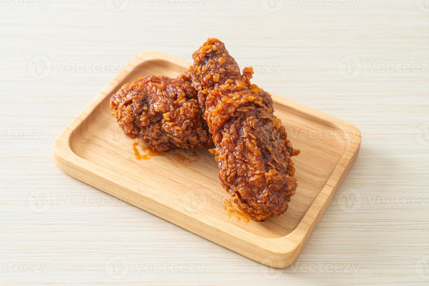 Fried chicken on wood photo