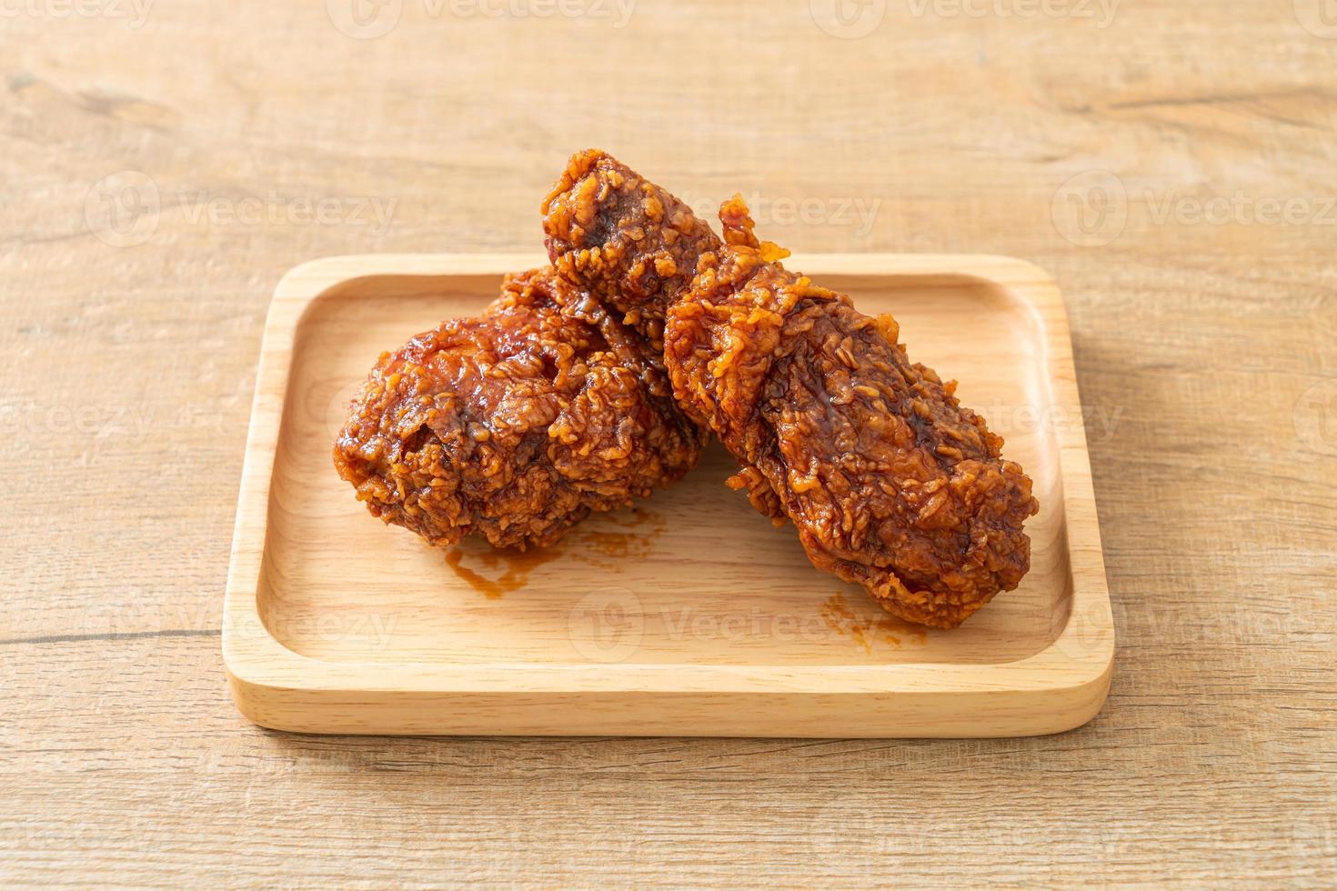 Fried chicken on wood photo