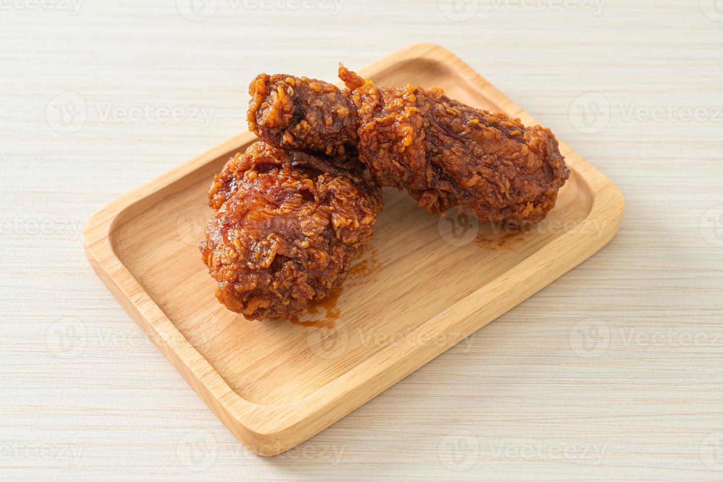 Fried chicken on wood photo