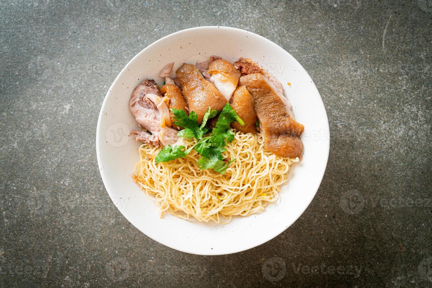 Dried stewed pork leg noodles bowl photo