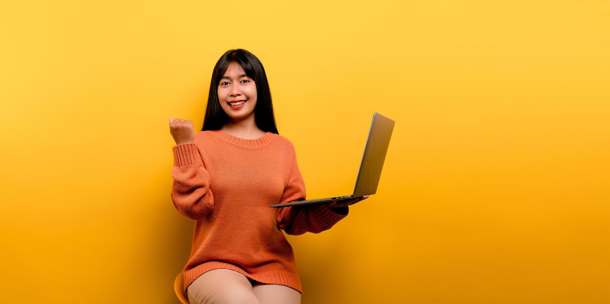 Asian woman and laptop and are happy to work Photo