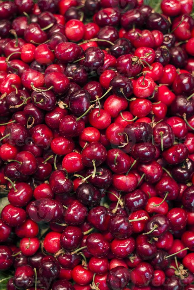 Fresh organic mixed red cherries on display photo