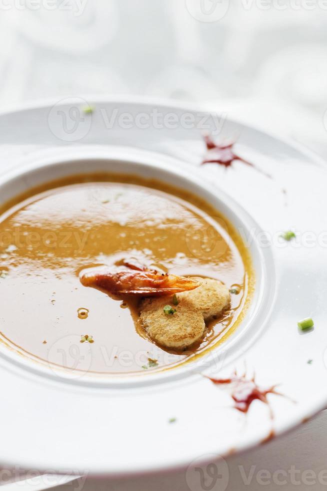 Gourmet creamy spicy fresh seafood prawn soup photo