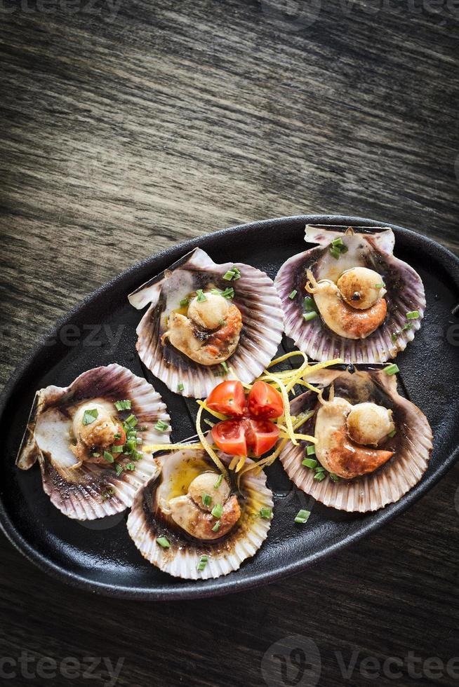 Fresh steamed gourmet scallop with Asian sweet-sour seafood sauce snack photo