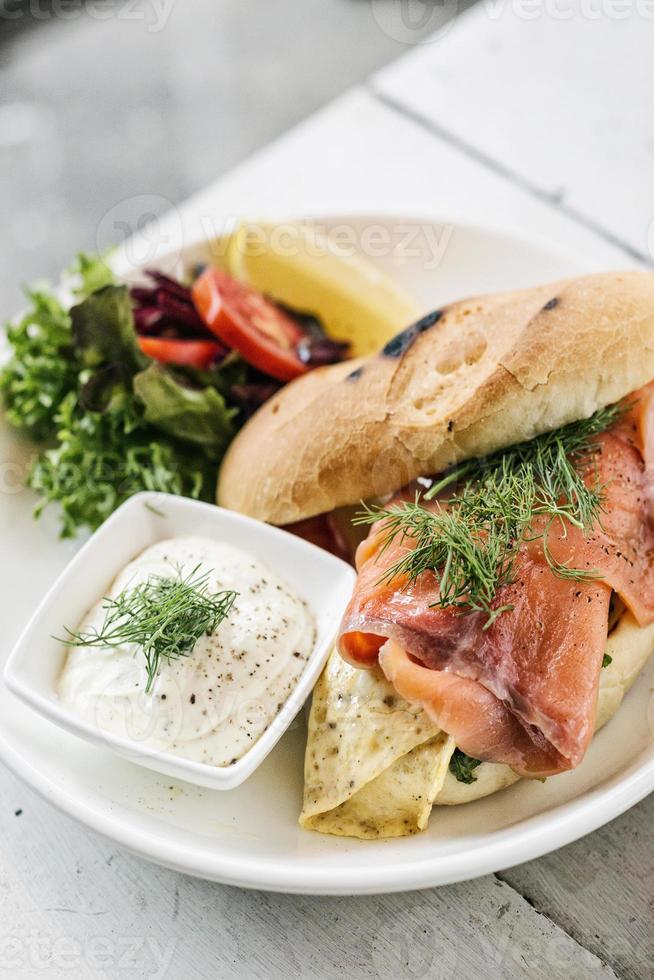 Scandinavian healthy fresh smoked salmon sandwich with egg and sour cream set meal photo