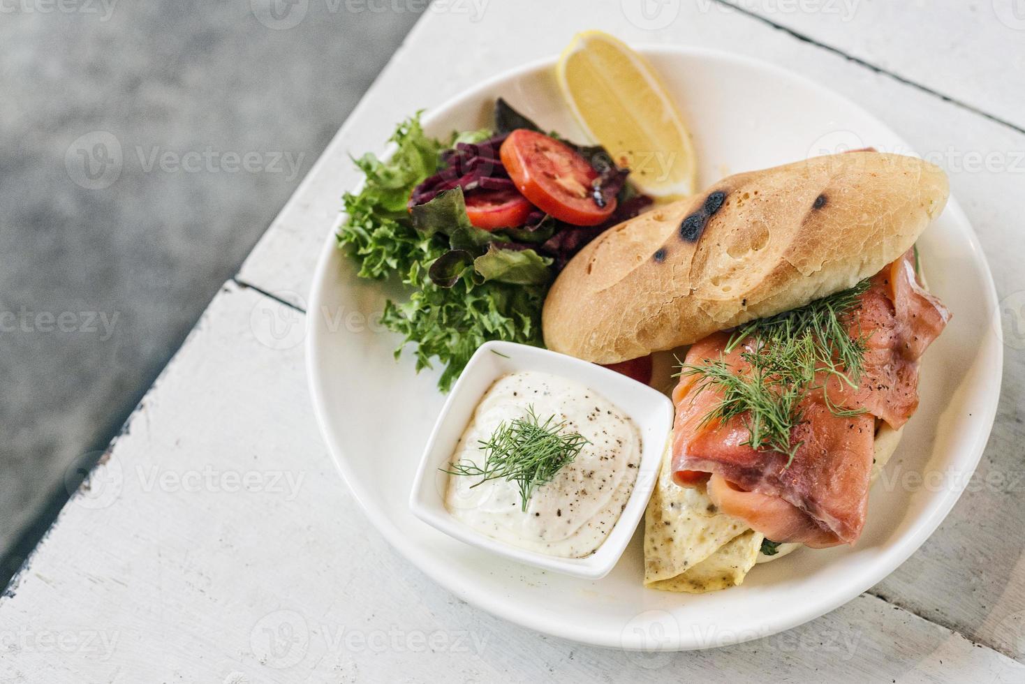 Scandinavian healthy fresh smoked salmon sandwich with egg and sour cream set meal photo