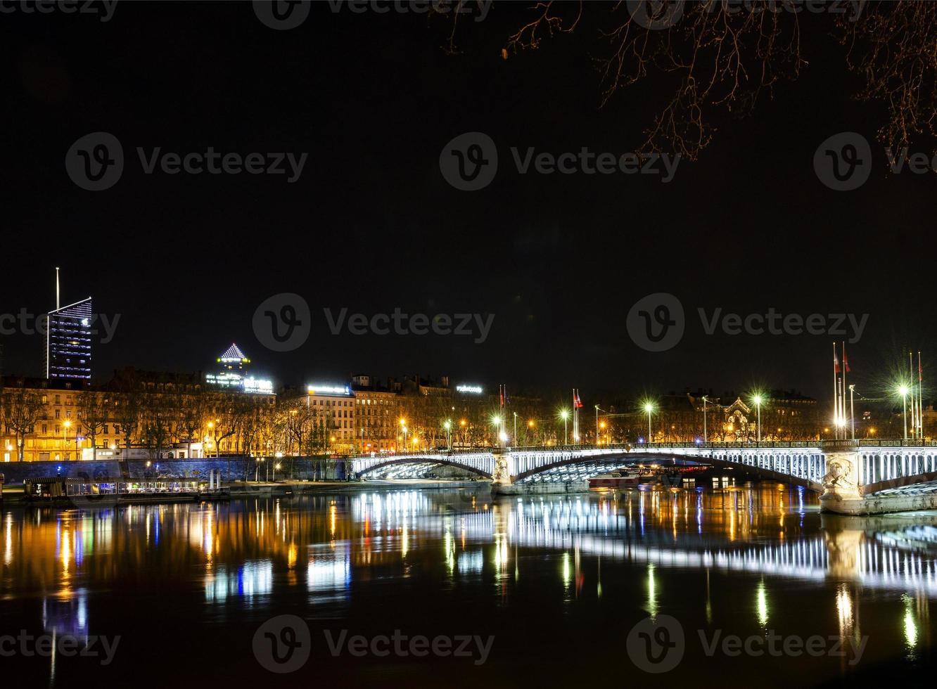 Central old town Lyon city and Rhone river side view at night in France photo