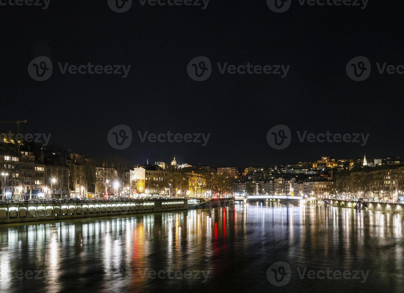 Central old town Lyon city and Rhone river side view at night in France photo