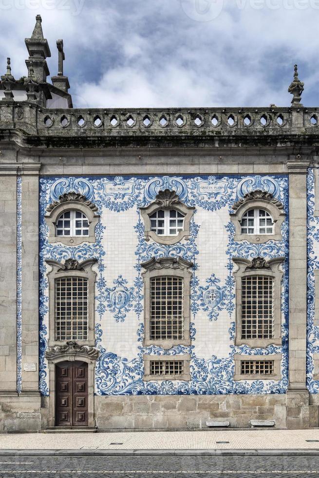 Traditional Portuguese Azulejo tiles on Carmo church exterior in Porto Portugal photo