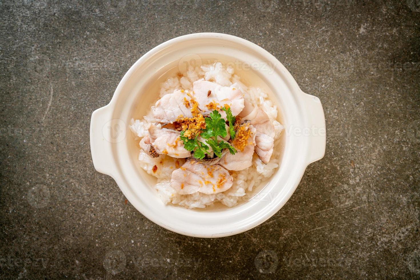 Boiled rice soup with fish photo