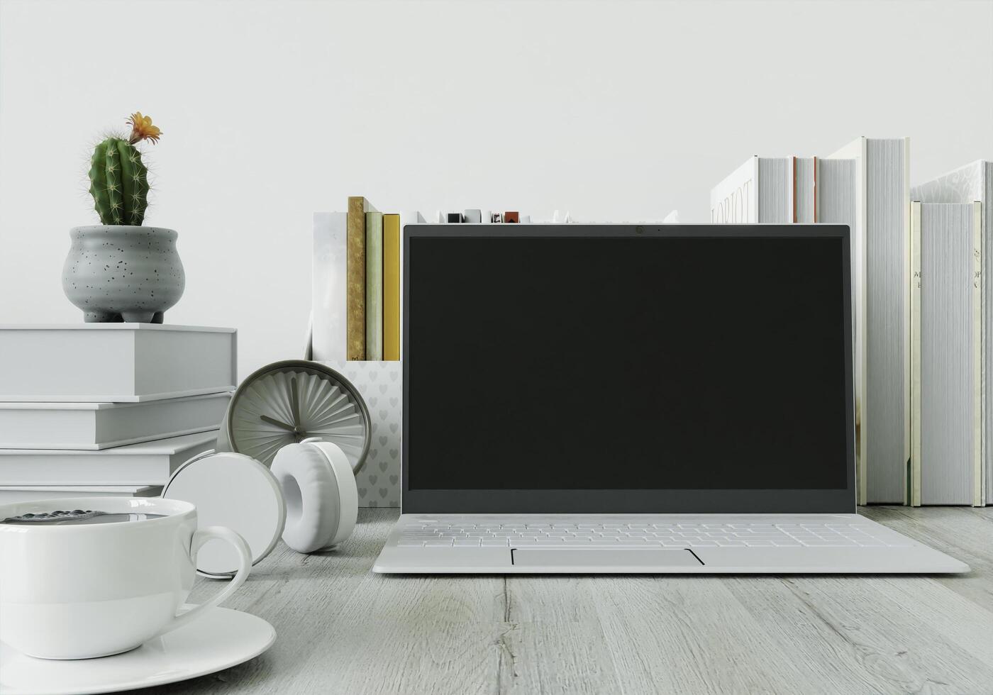 A desk with a laptop with a notebook Headphones and coffee cups photo