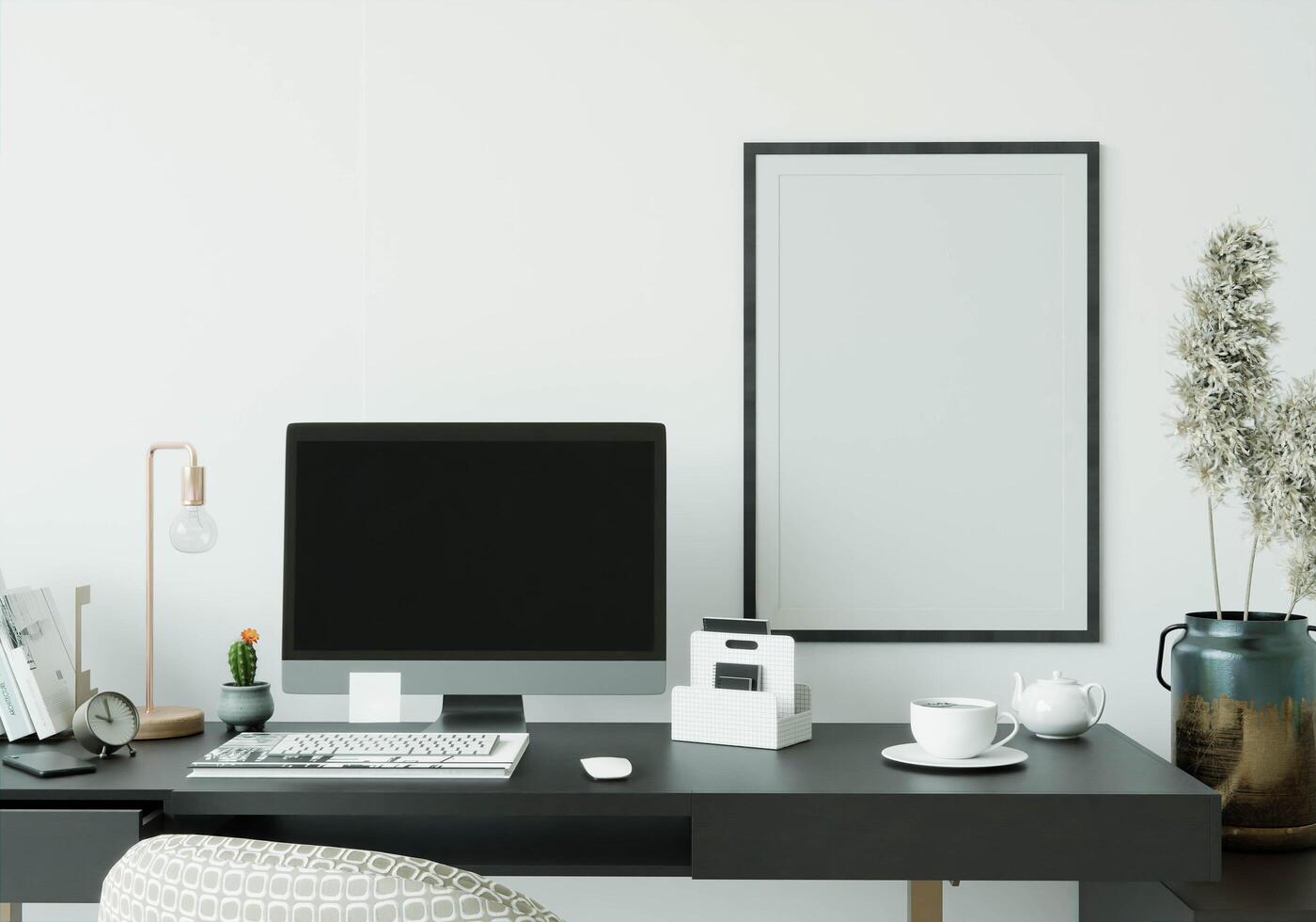 A working room with a computer placed on the table photo