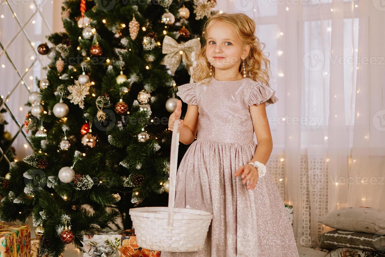 Girl in a pink dress with a wicker basket photo