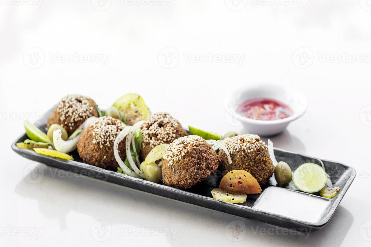 Chickpea falafel traditional Middle Eastern food snack platter starter set photo