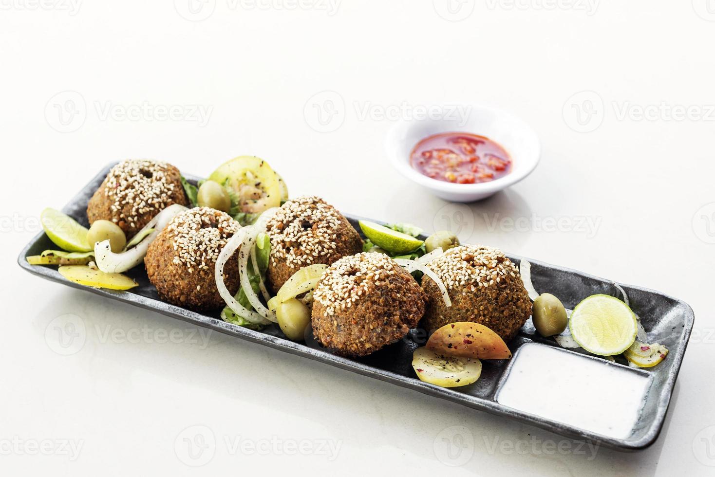 Chickpea falafel traditional Middle Eastern food snack platter starter set photo