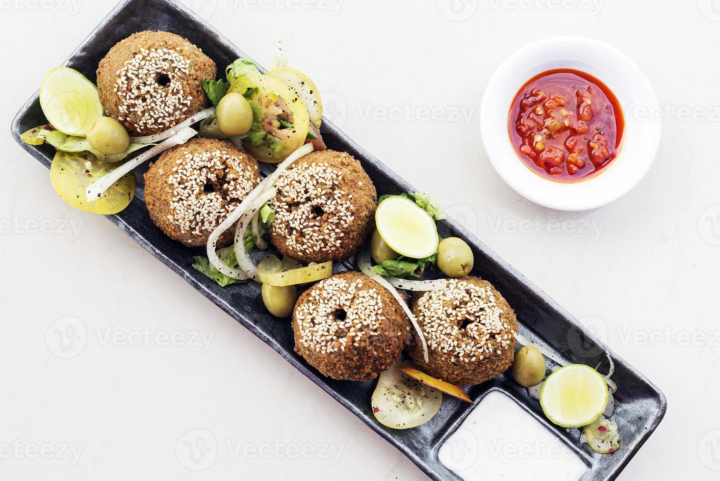 Chickpea falafel traditional Middle Eastern food snack platter starter set photo