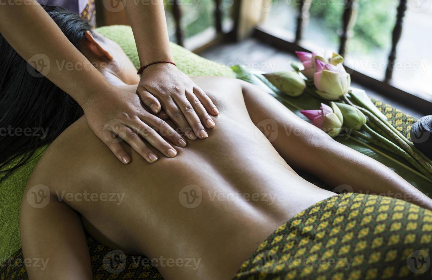 Asian massage spa natural organic beauty treatment with turmeric scrub paste photo