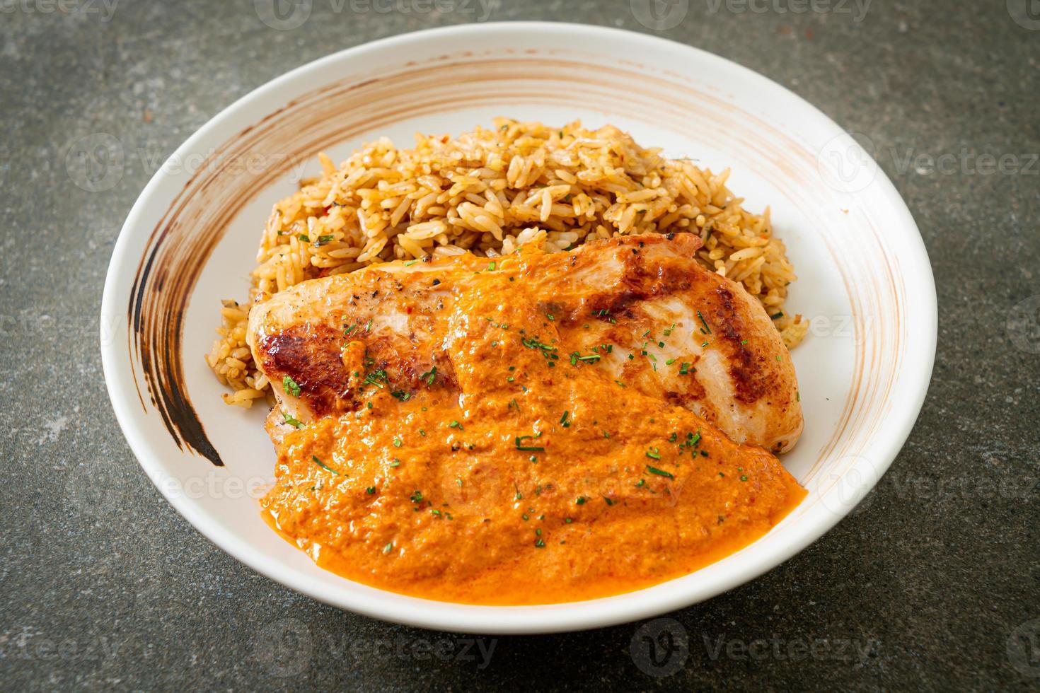 Grilled chicken steak with red curry sauce and rice photo
