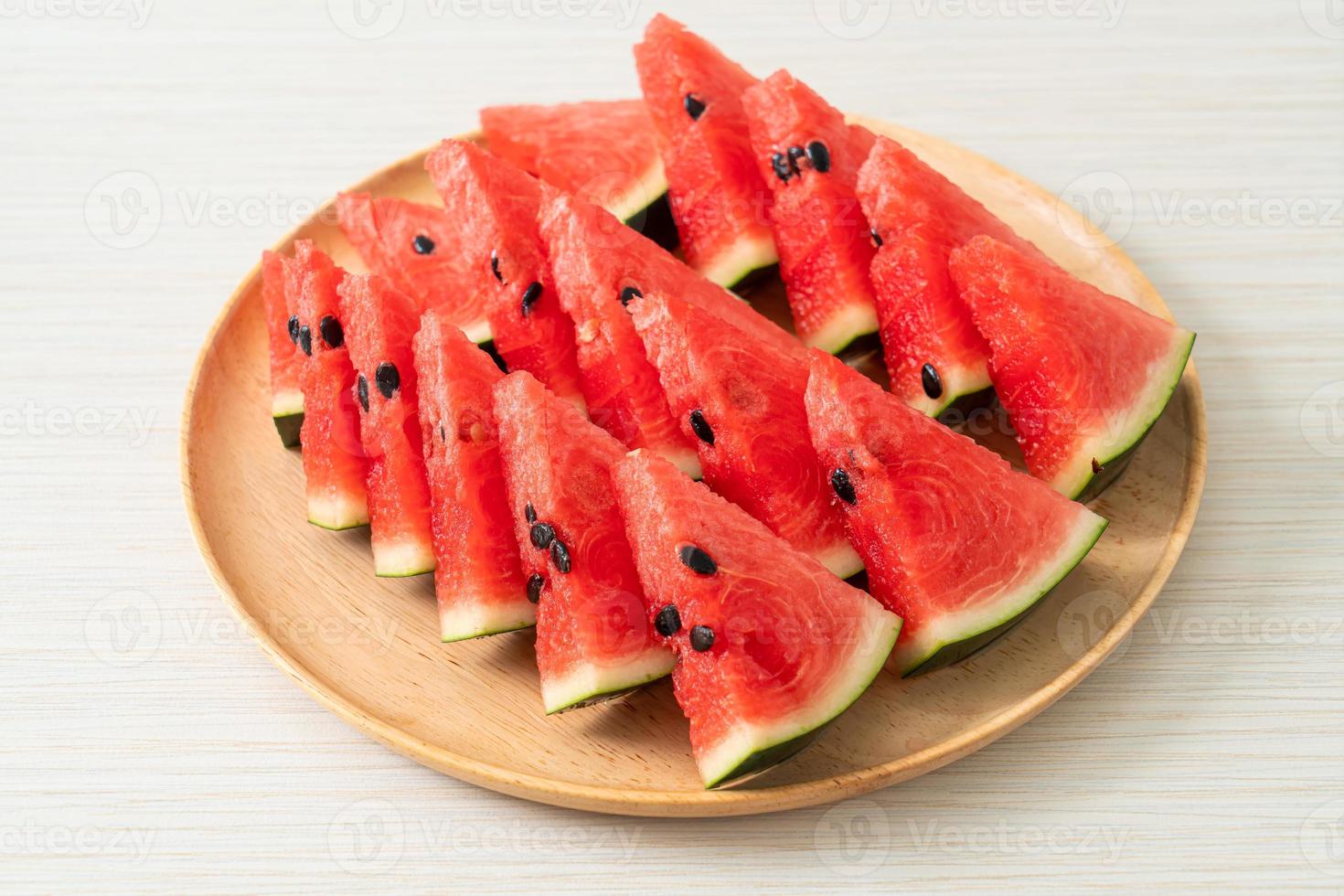 Fresh watermelon sliced on plate photo