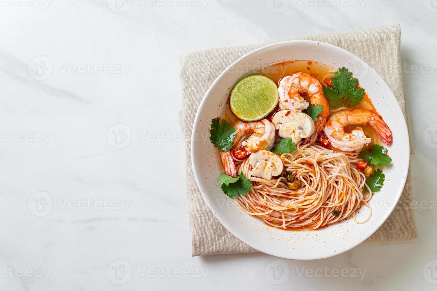 Noodles with spicy soup and shrimps photo