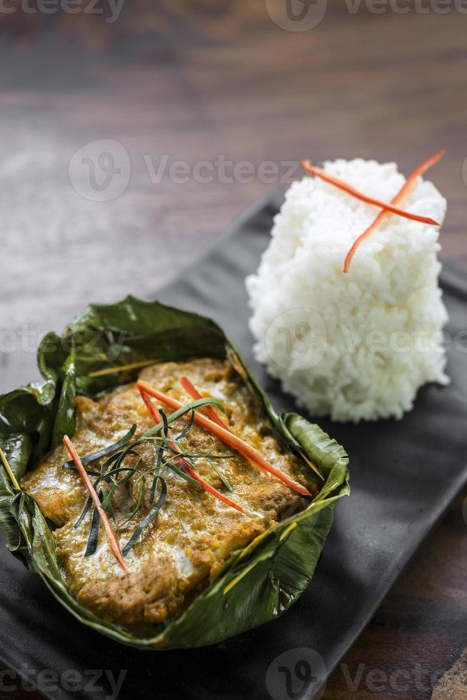 Traditional Cambodian Khmer fish amok curry meal photo