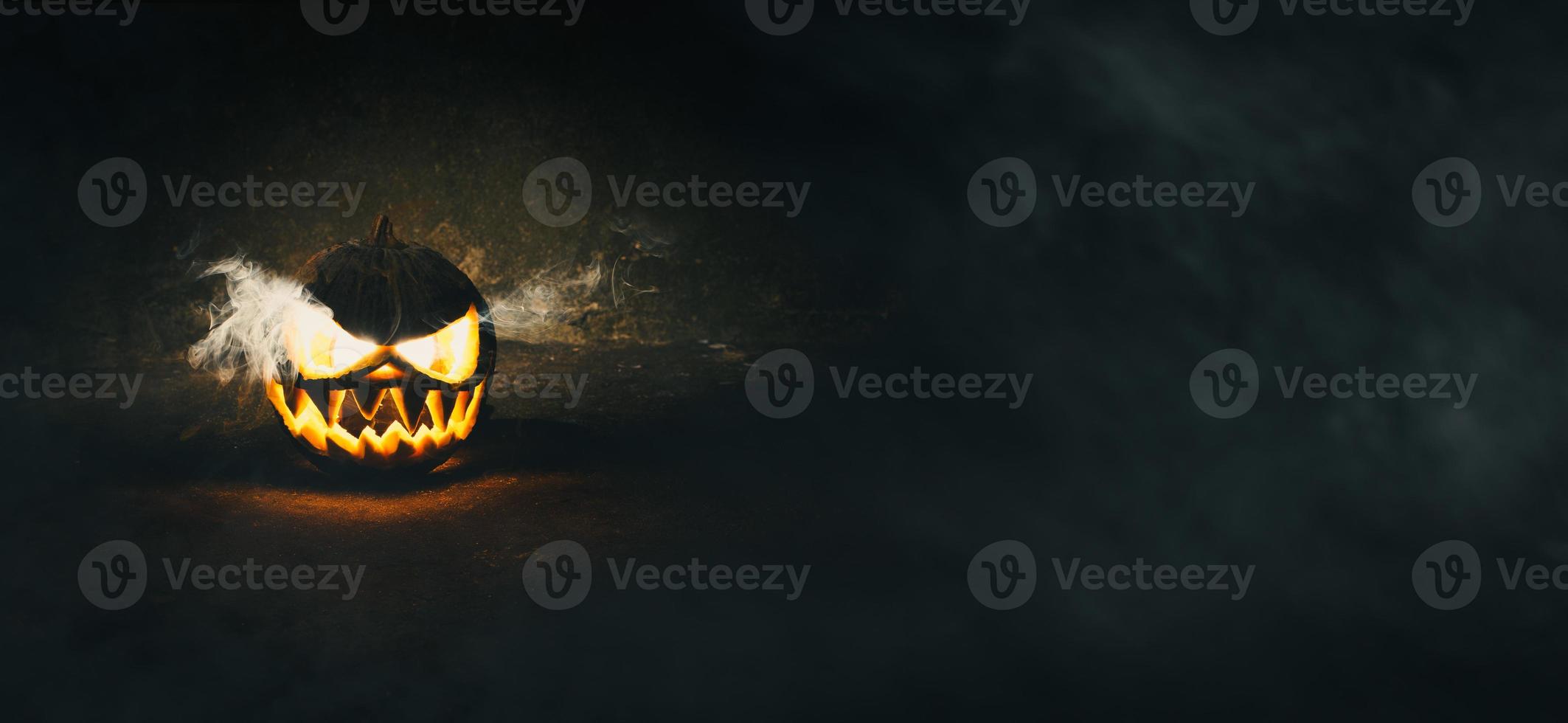 Halloween pumpkin on dark background photo