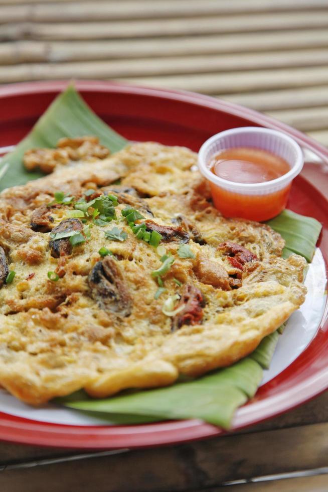 Oyster omelette and spicy sauce in Chinese style photo