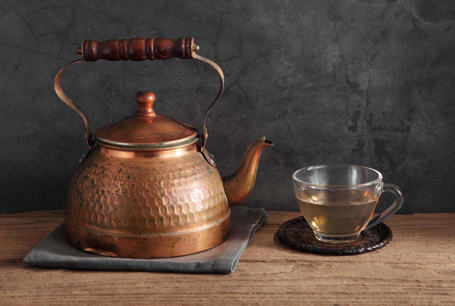 Group of Arabic tea in glass and metal tea pot photo