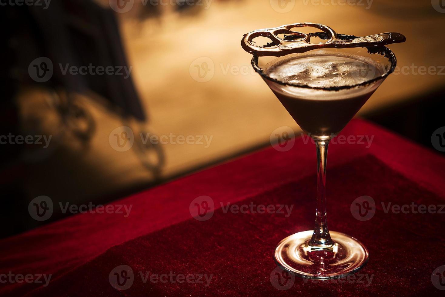 Chocolate martini cocktail drink in bar at night photo