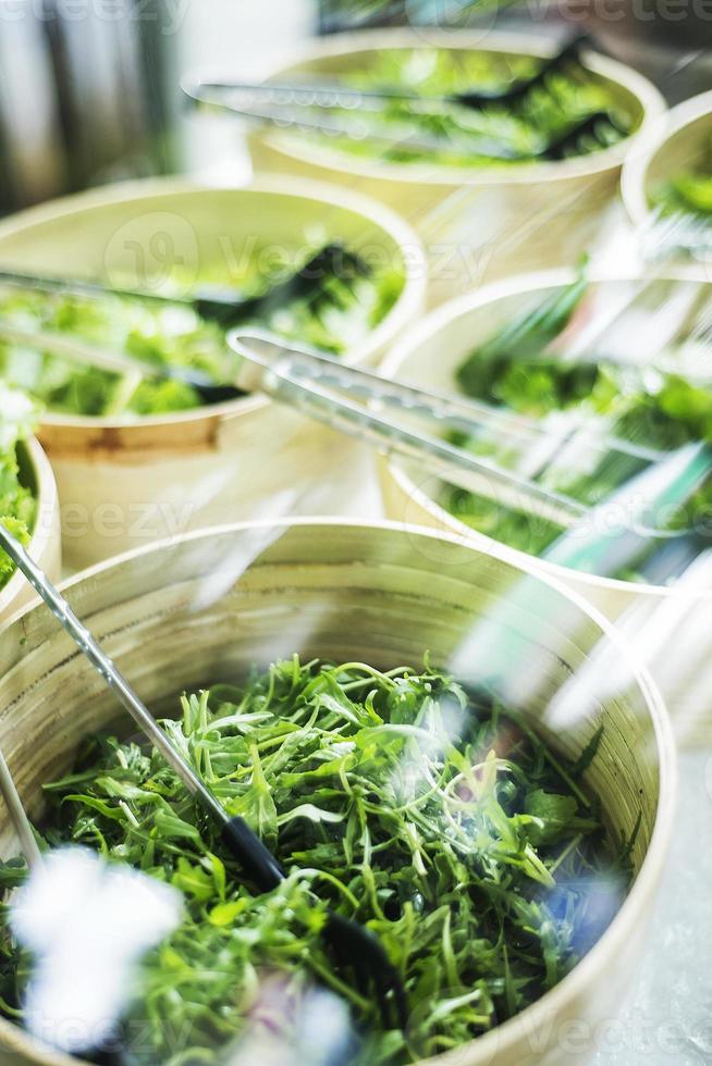 Salad bar buffet fresh mixed lettuce restaurant display detail photo