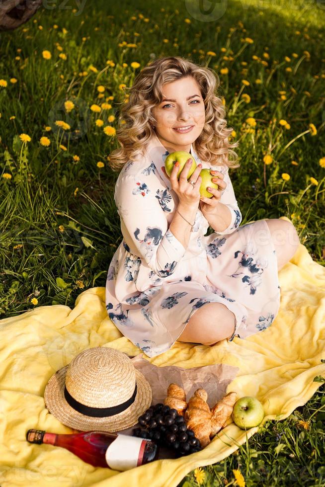 Beautiful woman, weekend out for a walk in a picnic park photo