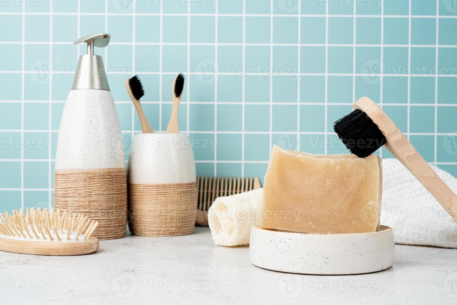 Bath accessories with bamboo brushes, handmade soap, dispenser photo