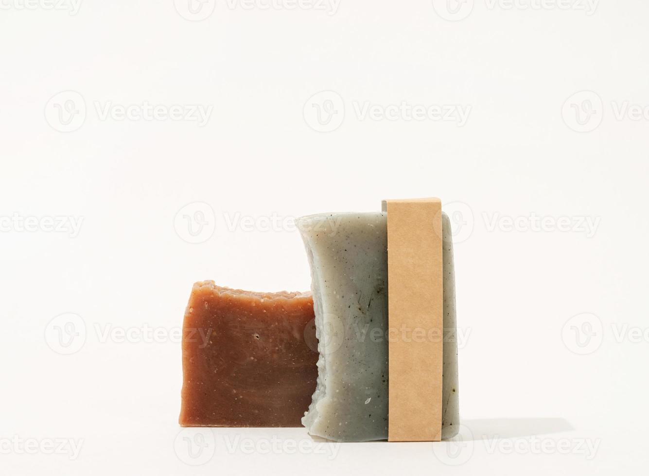 Stack of hand made soap and craft band for mock up design on white photo