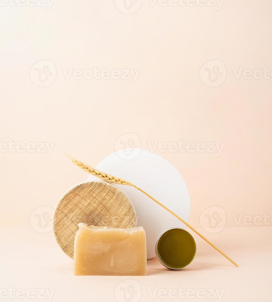 Creative art composition with soap and balsam, natural cosmetics photo