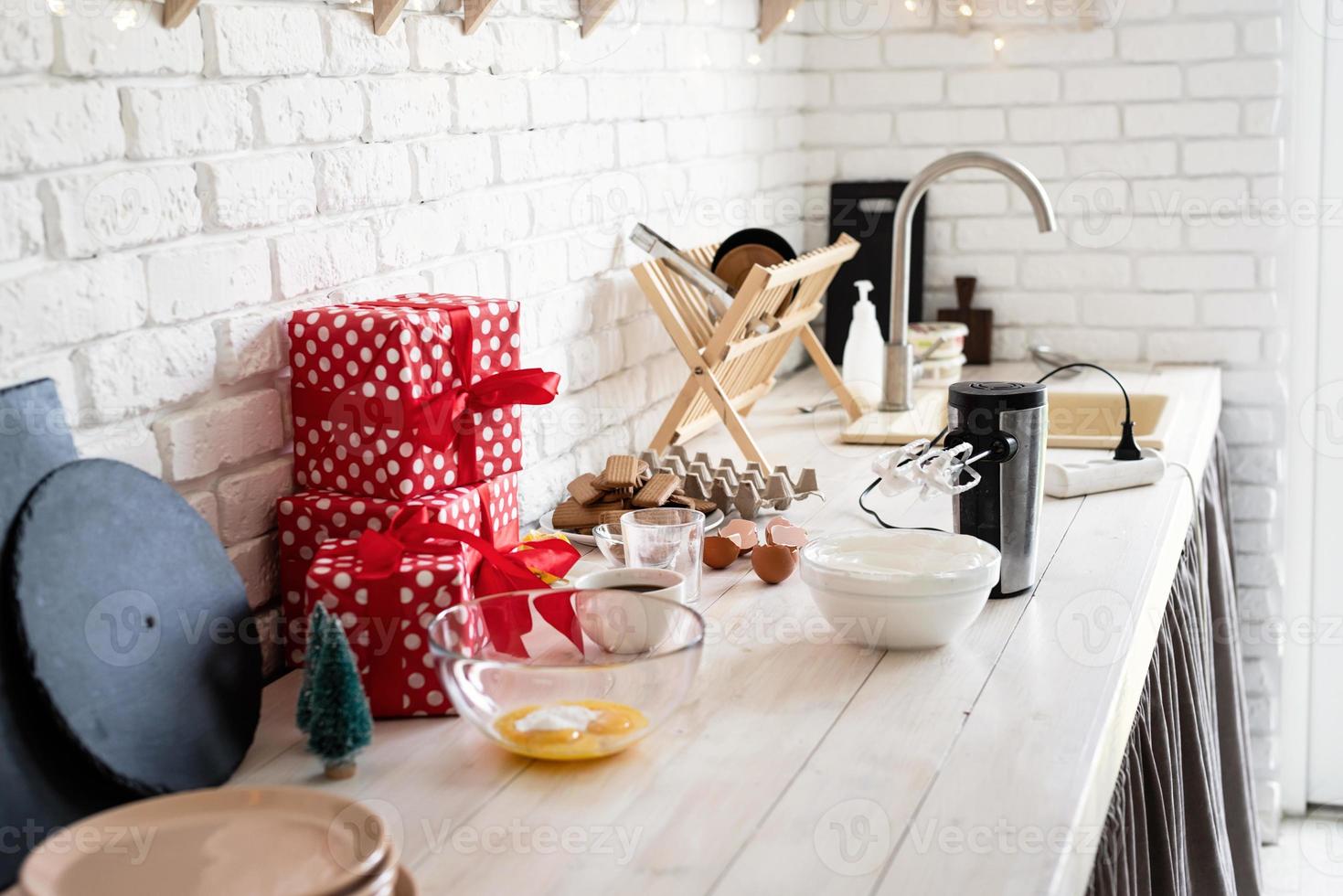 Kitchen interior with gift boxes, eggs and cooking unensils photo