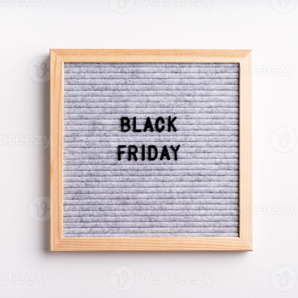 Text black friday on gray letter board on white background photo